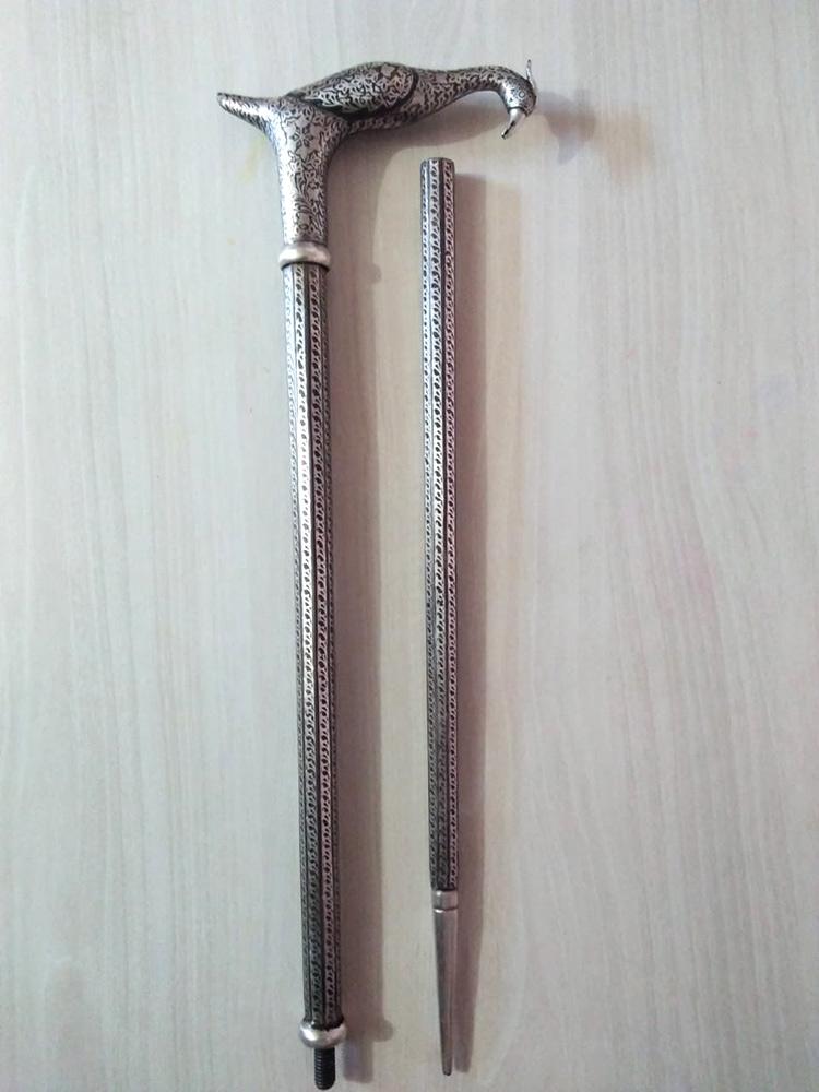 Close-up of gold and silver wire inlay on steel